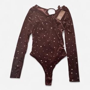 Black velvet bodysuit with star and moon pattern